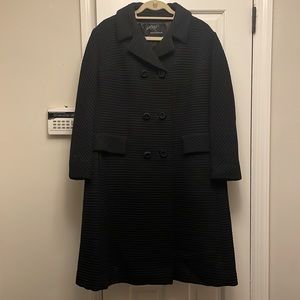 Beautiful 3/4 length double breasted coat made out of beautiful textured wool.